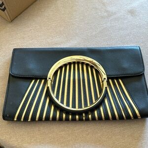 Gently worn PU leather clutch